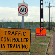 Traffic Controller in training yellow sign, at the start of work zone training