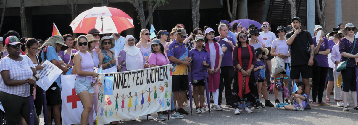 Group of people dressed in purple for International Women's Day March