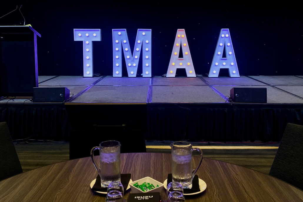 TMAA Sign in lights on a stage at the TMAA Annual Conference 2024