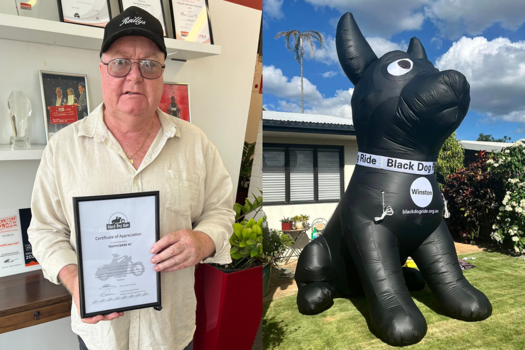 Our boss holding a certificate from Black Dog Ride and the Giant inflatable Winston that promotes the Black Dog Ride Charity.