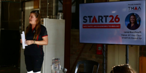 Lena is pictured stood up giving an industry update on the TMAA START26 Conference