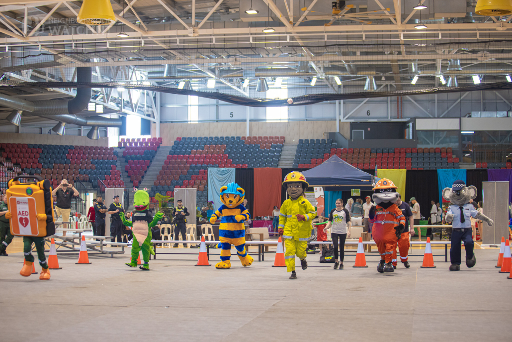 Safety mascots racing at the Darwin Safety Expo