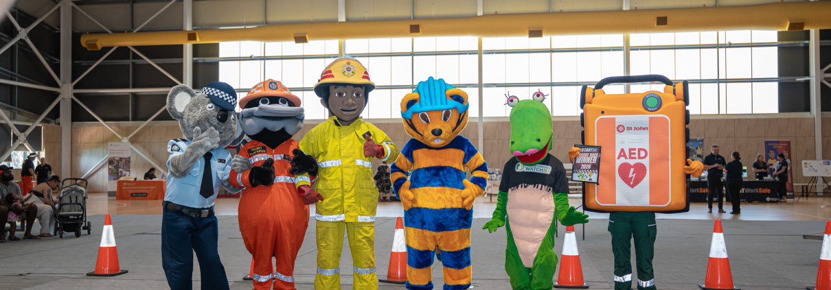 Safety mascots stand in a row at the Darwin Safety Expo